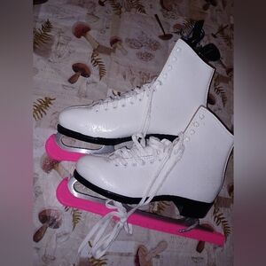 White lace-up figure skates, possibly a vintage Lange Ice Skates Size 8